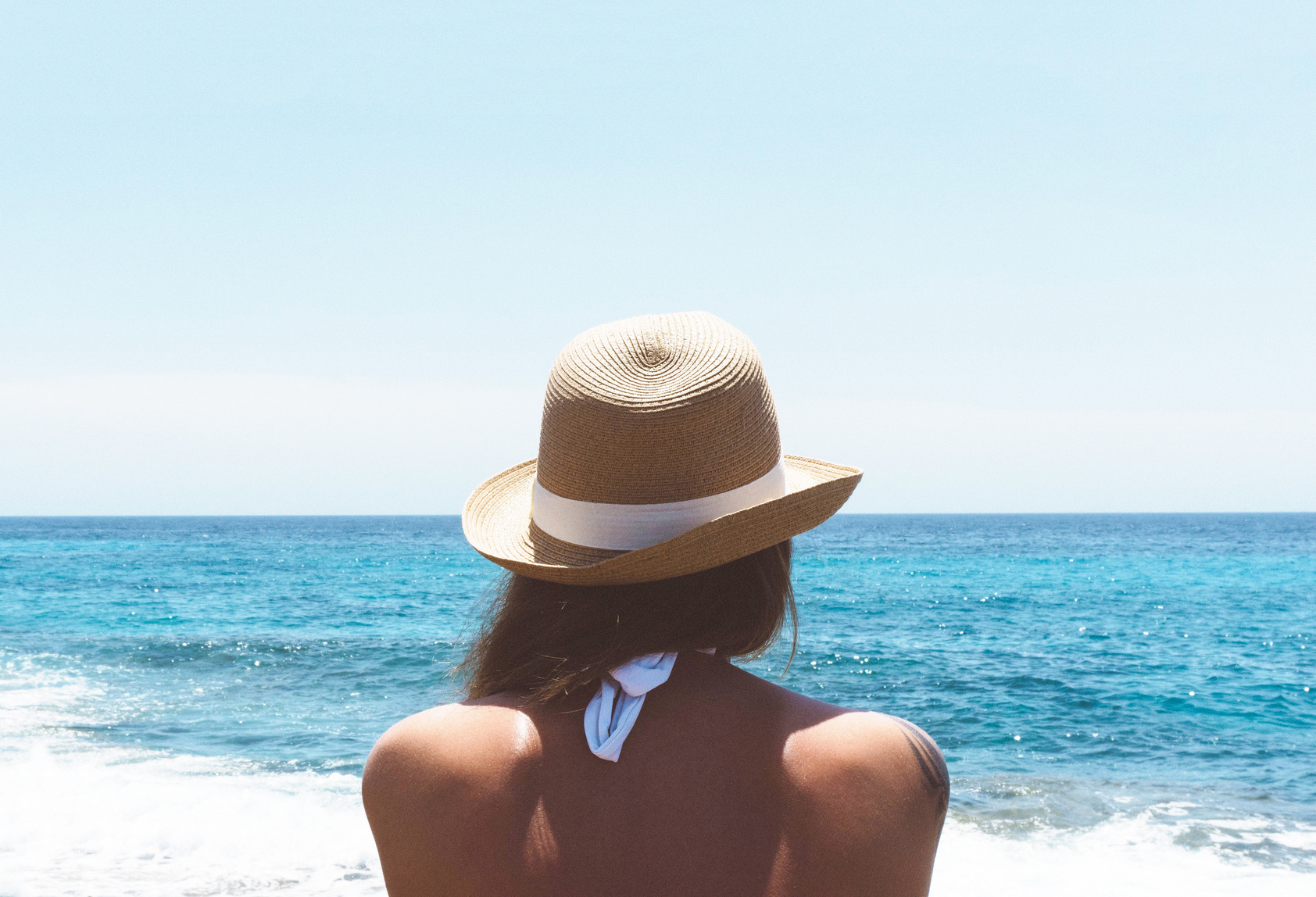 Woman in the Beach Wearing Hat